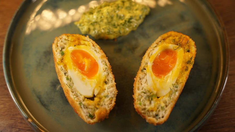 Yummy British Scotch Egg Dish With Runny Yolk Wallpaper