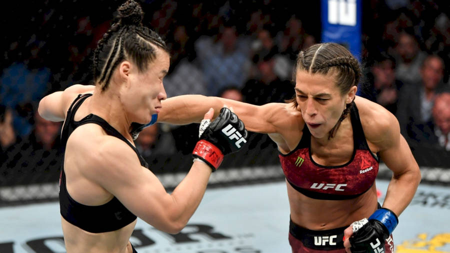 Zhang Weili In An Intense Ufc Fight Against Joanna Jedrzejczyk Wallpaper