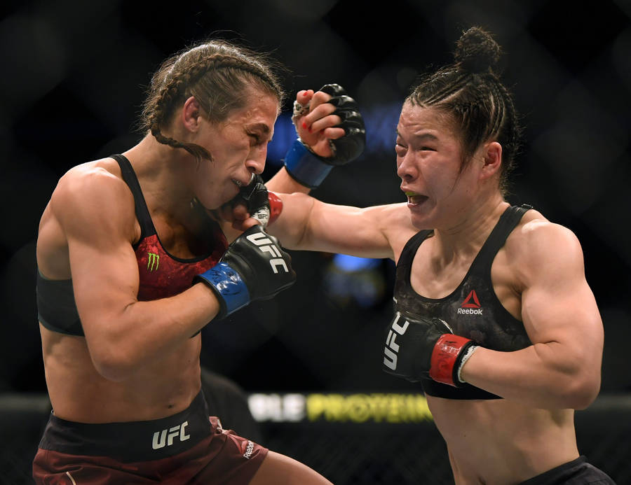 Zhang Weili Punching Joanna Jędrzejczyk Wallpaper