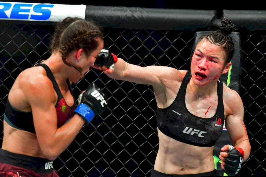 Zhang Weili Punching Joanna Jędrzejczyk Wallpaper