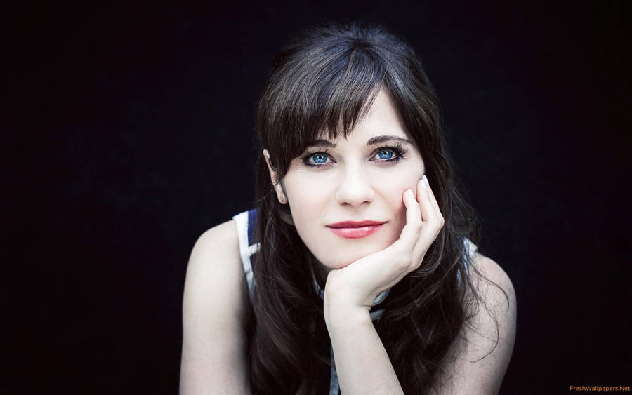 Zooey Deschanel Chin On Hand Black Background Wallpaper