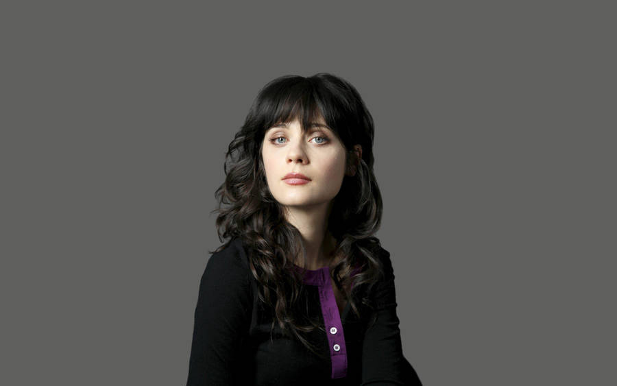 Zooey Deschanel In Black On Gray Background Wallpaper