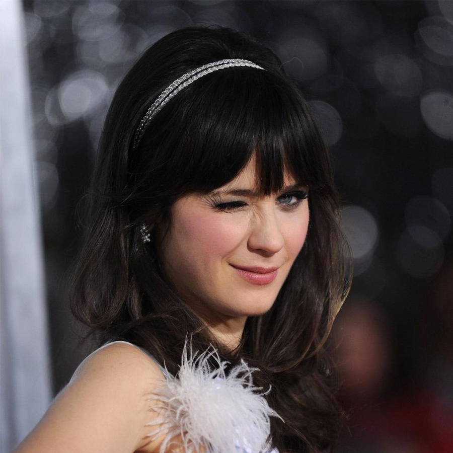 Zooey Deschanel Winking At Event Wallpaper