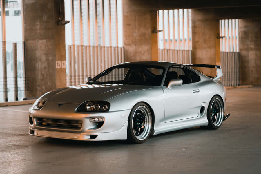 Zoom Past In Style With A Toyota Supra Wallpaper