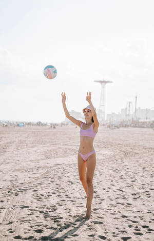 3 Talented Volleyball Players With A Passion For The Game Wallpaper