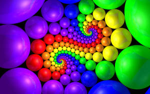 3d Colorful Balls In Swirling Design Wallpaper