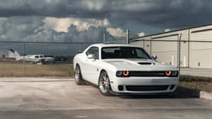 4k Dodge Hellcat Parked At A Hangar Wallpaper