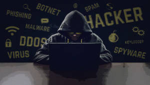 4k Laptop Hooded Hacker Man Wallpaper