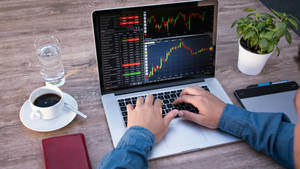 4k Laptop Monitoring Stock Market Wallpaper