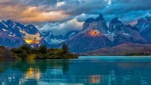 4k Nature Mountains Under Cloudy Skies Wallpaper