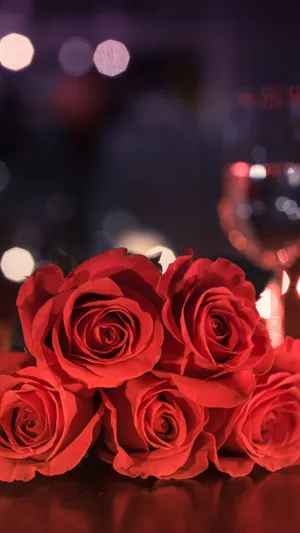 A Beautiful Pink Rose Reveals Its Delicate Petals In An Intimate Portrait. Wallpaper