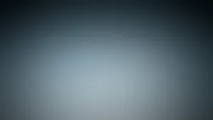 A Black And White Background With A Blurry Image Wallpaper