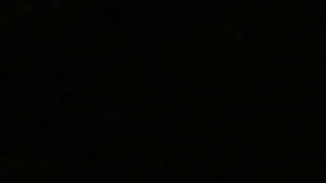 A Black Background With A Few Dots Wallpaper