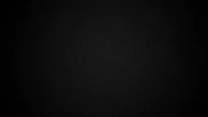 A Black Background With A Light Shining On It Wallpaper