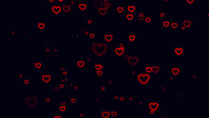 A Black Background With Red Hearts On It Wallpaper