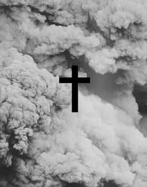 A Black Cross Lone Against A White Sky Wallpaper