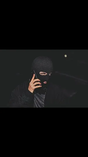 A Black Ski Mask Obscures The Identity Of The Wearer. Wallpaper