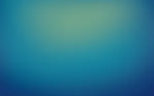A Blue And Green Blurred Background Wallpaper