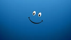 A Blue Background With A Smiling Face On It Wallpaper