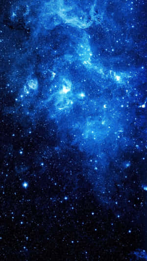 A Blue Space With Stars And Nebula Wallpaper