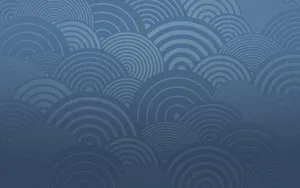 A Blue Wallpaper With Waves On It Wallpaper
