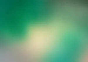 A Blurry Background With Green And Yellow Wallpaper