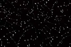 A Breathtaking Black And White Star Shining Brightly In The Night Sky Wallpaper