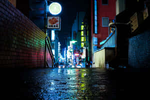 A Brilliant Nightscape Of Kyōto, Japan Dominated By Red Neon Signage Wallpaper