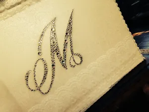 A Cake With A Monogram On It Wallpaper