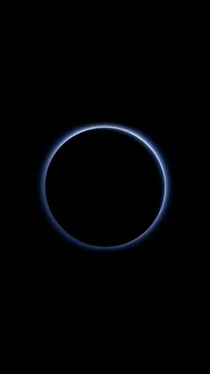 A Circle Of Light Is Seen In The Dark Wallpaper