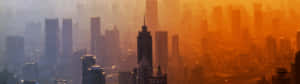 A Cityscape With Buildings And A Sunset Wallpaper
