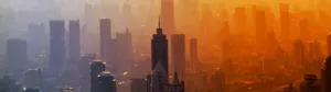A Cityscape With Buildings And A Sunset Wallpaper
