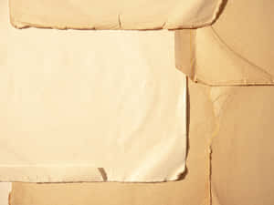 A Close-up Image Of Paper With Torn Edges Wallpaper