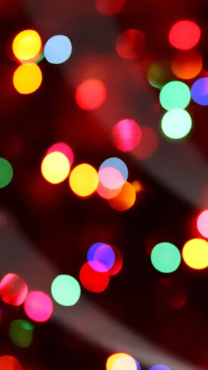 A Close Up Of A Red And Green Christmas Tree Wallpaper