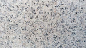 A Close Up Of A White Granite Surface Wallpaper