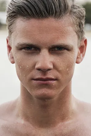 A Close-up Shot Of A Man Covered In Sweat Wallpaper