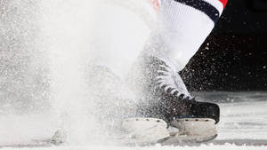 A Close-up View Of Ice Skating Shoes Wallpaper