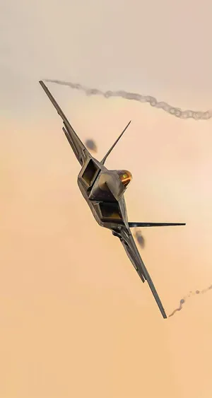 A Closeup Of An F-22 Raptor Jet In Flight Wallpaper