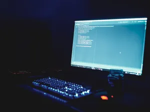 A Computer Screen Is On A Desk Wallpaper