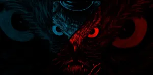 A Dark Blue And Red Owl With A Red Eye Wallpaper