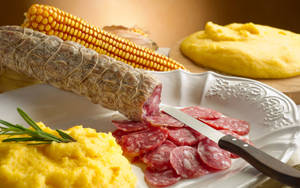 A Delectable Dish Of Salami And Polenta Wallpaper