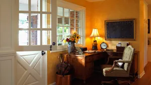 A Desk In A Room With A Door Wallpaper