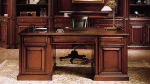 A Desk With A Chair And A Lamp Wallpaper