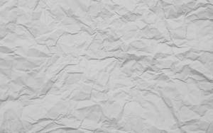 A Detailed Close-up Of White Crumpled Paper Texture Wallpaper