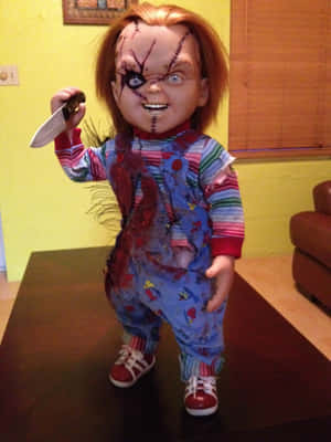 A Doll With A Knife Is Standing On A Table Wallpaper