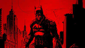 A Fearsome Batman Surveys The City Of Gotham Wallpaper
