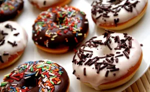 A Feast Of Sprinkled Donuts Wallpaper
