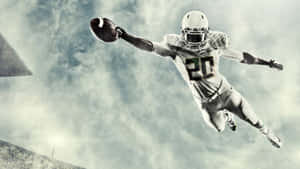 A Football Player In The Air Wallpaper