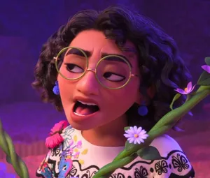 A Girl In Glasses Is Holding Flowers Wallpaper