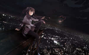A Girl Sitting On A Ledge In A City At Night Wallpaper
